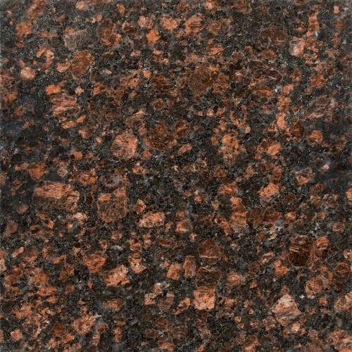 Natural granite fountain in residential landscape